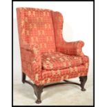 A 19th Century Georgian wingback armchair, the sha