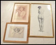 A collection of three framed and glazed portrait n