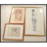 A collection of three framed and glazed portrait n