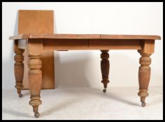 A 19th century Victorian oak extendable dining tab
