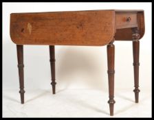 A Victorian mahogany pembroke dining table raised