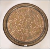 A large 19th century Indian brass and copper wall