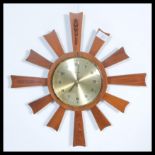 A vintage retro mid century teak starburst sunburs