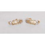 A pair of 9ct gold diamond earrings having white g