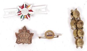 COLLECTION OF WWI & WWII MILITARY BADGES & BUTTONS