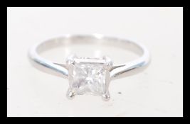 An 18 carat white gold single stone diamond ring h