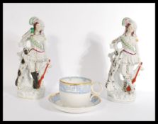 A pair of 19th century Staffordshire flatback figu