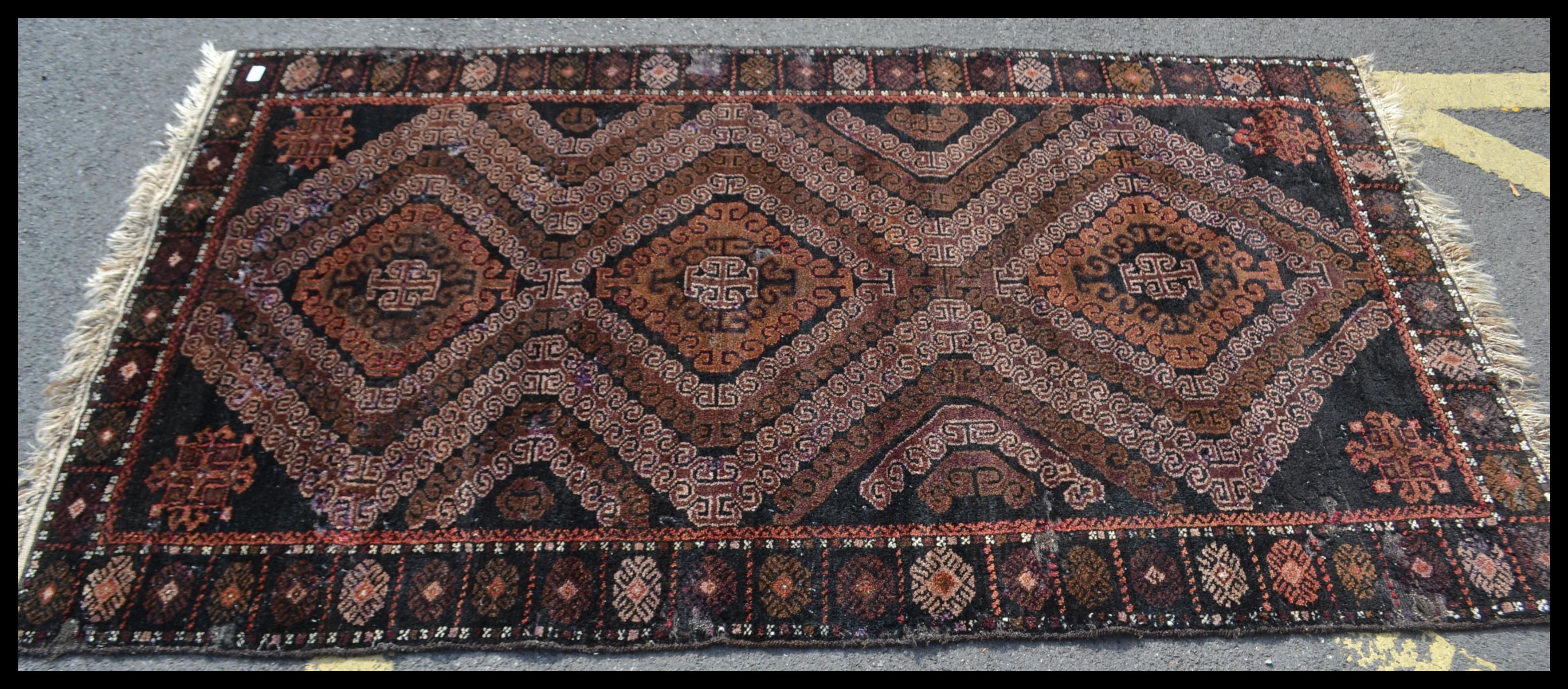 An early 20th Century Middle Eastern floor rug on