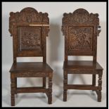 A pair of 19th century armorial carved oak hall /