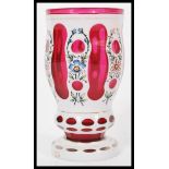 A 19th century Bohemian cranberry glass goblet hav