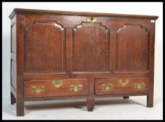 An 18th century George III country oak mule chest