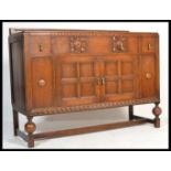 A 1920's Art Deco oak sideboard dresser raised on
