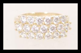 A hallmarked 9ct yellow gold cluster ring having w