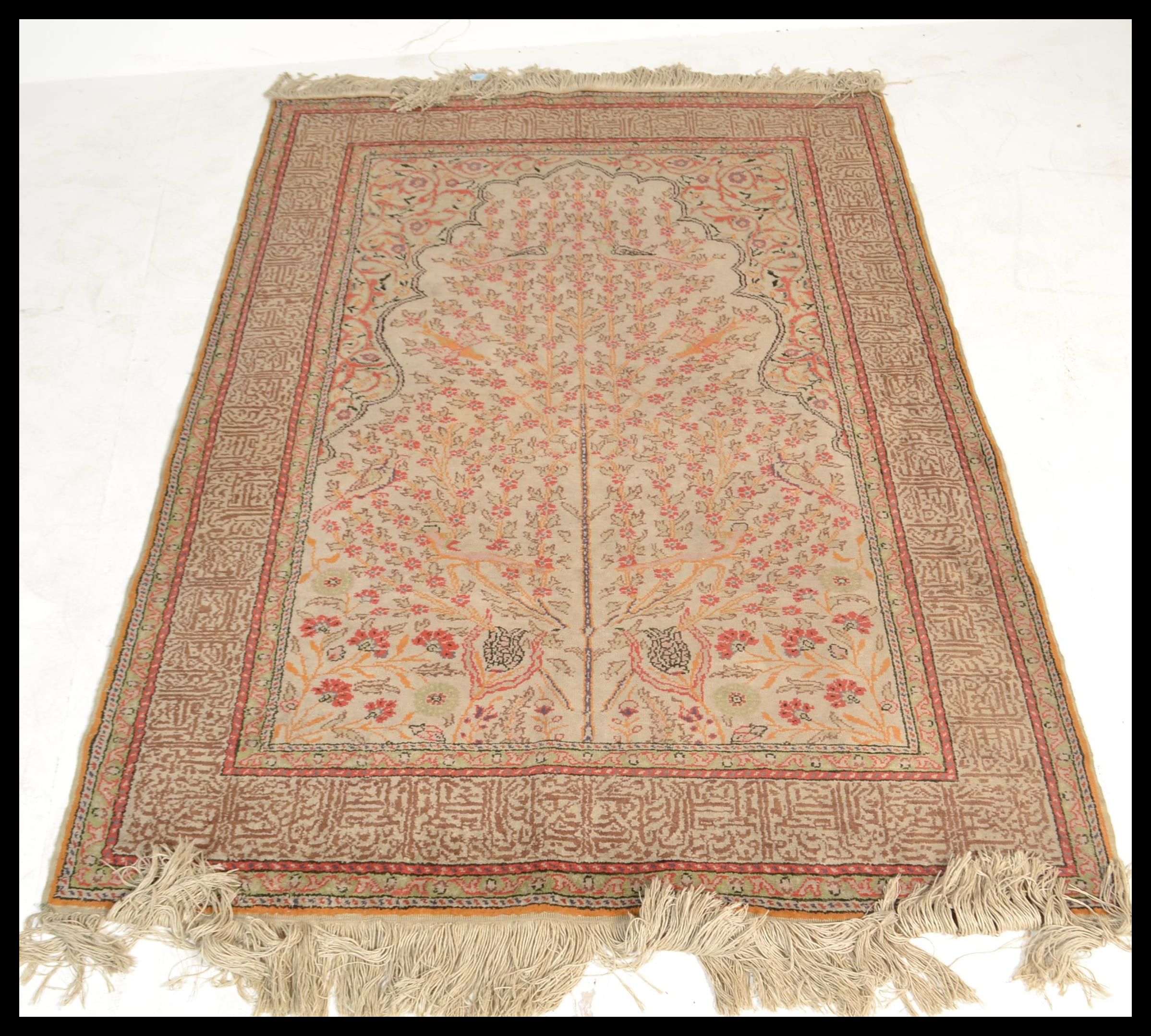 A 20th century Turkish Islamic carpet rug having a