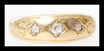An 18ct gold and diamond 3 stone ring hallmarked f