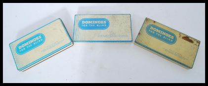 A collection of 3 mid century tin cased Braille Do