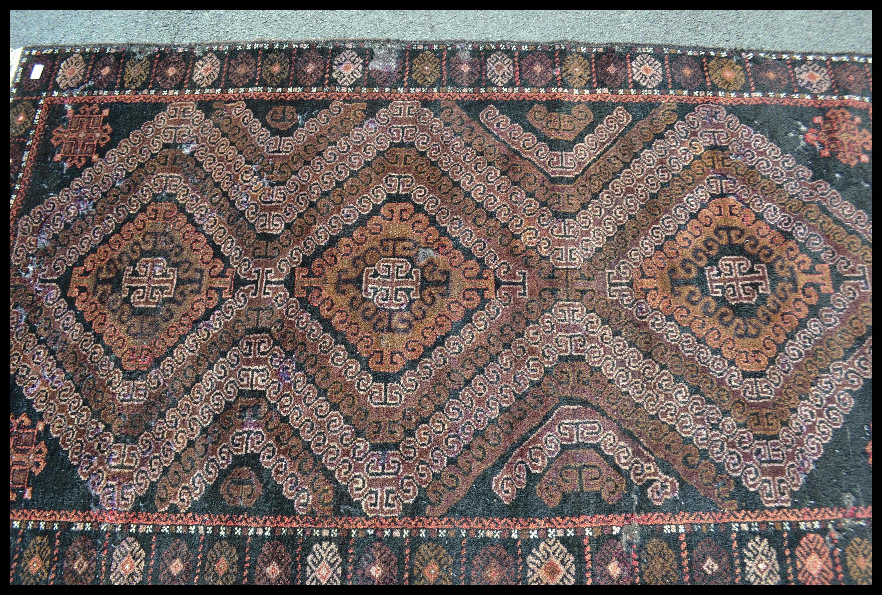 An early 20th Century Middle Eastern floor rug on - Image 2 of 4