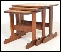 A retro 20th Century G - Plan teak wood tiled top