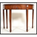 A 19th century George III mahogany demi - lune con