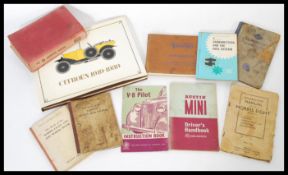 A group of vintage classic car motoring books and