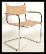 A retro style chrome cantilever dining chair with