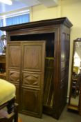 An 18th century carved oak French armoire wardrobe