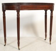 An 18th century George III mahogany tea table bein