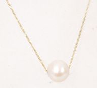 A pearl pendant necklace on a 9ct gold chain with