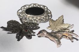 A collection of four vintage brooches to include a