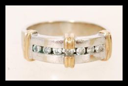 A hallmarked 9ct white and yellow gold channel set