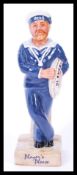 A Royal Doulton advertising ceramic figurine John