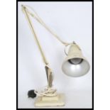 A vinatge retro 20th century 1940's Industrial pre-war Herbert Terry anglepoise desk lamp, raised on