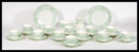 An early 20th Century bone extensive bone China transfer printed tea service to include trio,