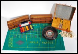 A selection of vintage 20th century boxed table games to include a Mahjong tile set, a set of casino