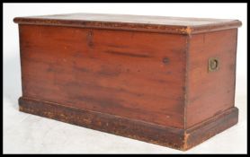 A 19th century Victorian large pine blanket box storage coffer chest having a hinged lid with