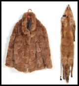 A brown rabbit fur coat jacket size 18 with quilted lining and a real full fox skin with glass