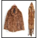 A brown rabbit fur coat jacket size 18 with quilted lining and a real full fox skin with glass