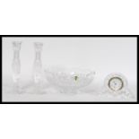 A selection of Waterford crystal to include a cut glass punch bowl, a mantle clock with roman