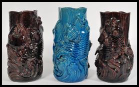 A group of three 20th century ceramic vases in the form of Koy carp fish fish jumping from water