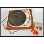 A Garrard 4HF vintage four speed record player, with auto stop, with its original rubber platter, on