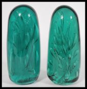 A pair of 19th century Victorian glass dump paper weights,with free form with air inclusions.