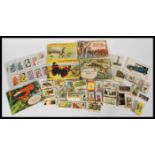 A collection of cigarette cards and tea cards including a collection of 'Wildlife in Danger' by
