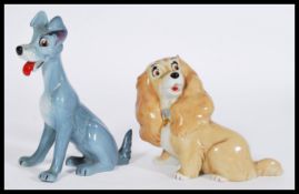 A Wade whimsy large pair of Lady and the Tramp figurines, stamped to the bases. Measures: 15cm