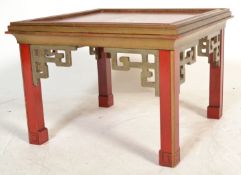 A 20th century lacquered occasional Chinese side table with painted scenes to the top, on square