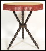A 19th Century Victorian ebonised and gilt framed Gypsy table, with velvet covered top and raised on