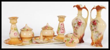 A 20th Staffordshire century dressing table set with floral motifs and gilt work to the rims stamped