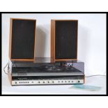 A vintage 1970's Fidelity Studio 6 teak cased and smoked perspex housing, consisting radio, tape and