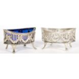 A pair of 19th century silver hallmarked table salts of elliptical form raised on pad feet with