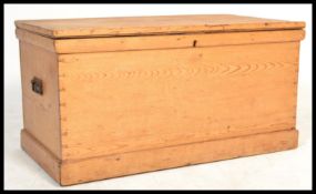 A 19th century Victorian large pine blanket box storage coffer chest having a hinged lid with