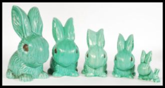 A selection of vintage 20th century graduating ceramic green SylvaC figurines having stamped numbers